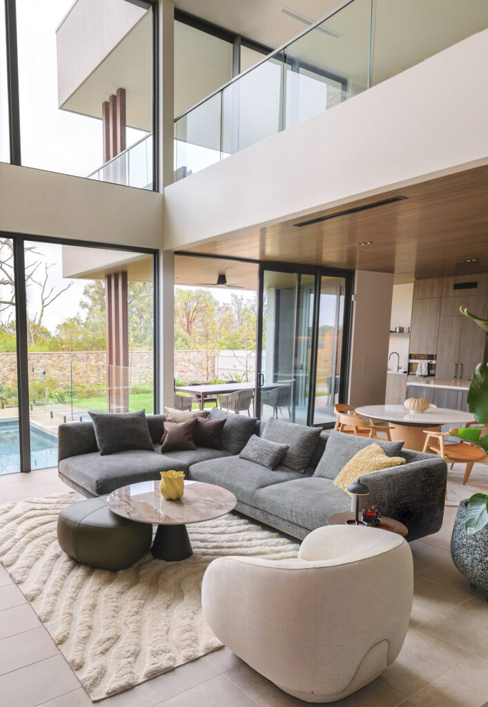 modern interior design with gray sofa and white armchair